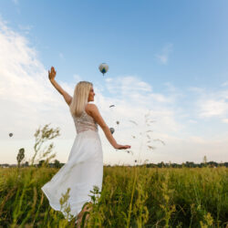 A tourist woman enjoying wonderful view of the balloons. Happy Travel concept